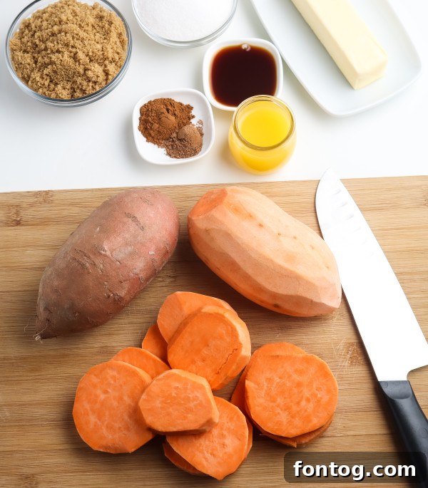 Close-up of peeled and sliced yams or sweet potatoes on a cutting board