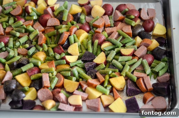 Effortless Sausage and Veggie Sheet Pan Dinner 4 Close-up of sliced smoked sausage on a cutting board