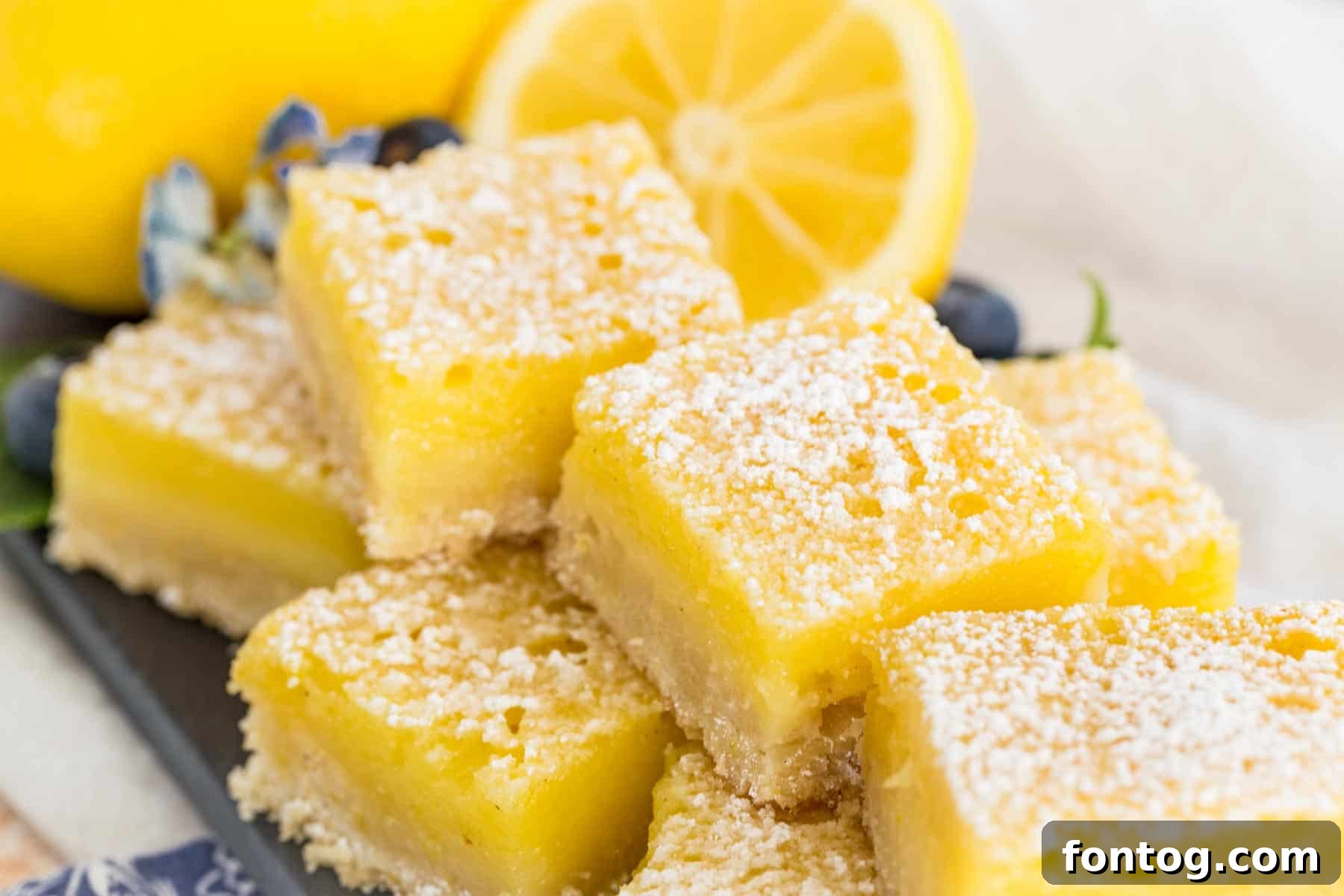 Delightful Gluten-Free Easter Desserts 23 Easy Gluten Free Lemon Bars with a dusting of powdered sugar.