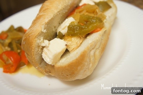 Slow Cooker Philly Chicken and Cheese Sandwich on a gluten-free bun