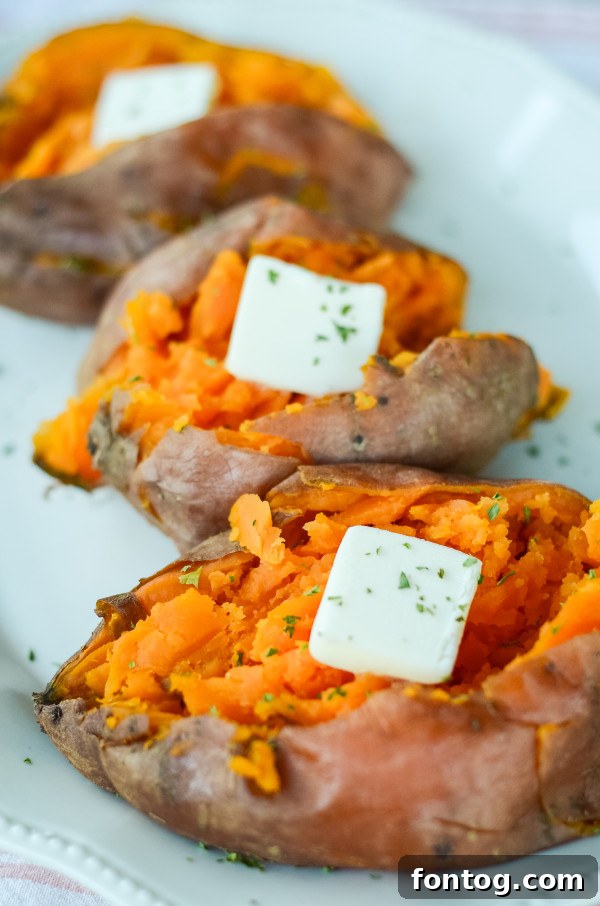 Ultimate Pellet Grill Smoked Sweet Potatoes 2 Smoked sweet potatoes cooked on a pellet grill, ready to be served as a delicious side dish.