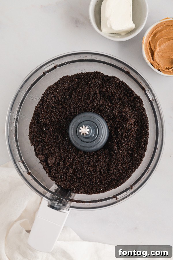 Crushing gluten-free Oreos in a food processor, the first step for delicious truffles.