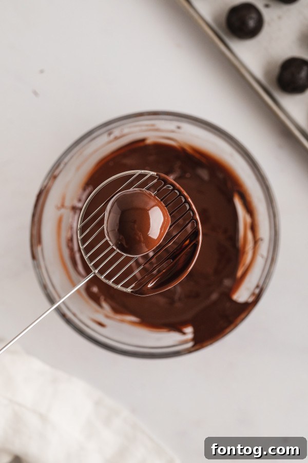 Gluten-free truffles covered in sprinkles on parchment paper, hardening.