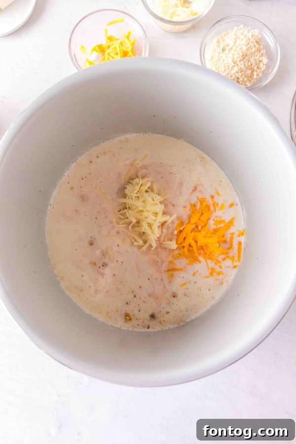 Prepared ingredients for Ninja Foodi Buffalo Macaroni and Cheese laid out on a counter.