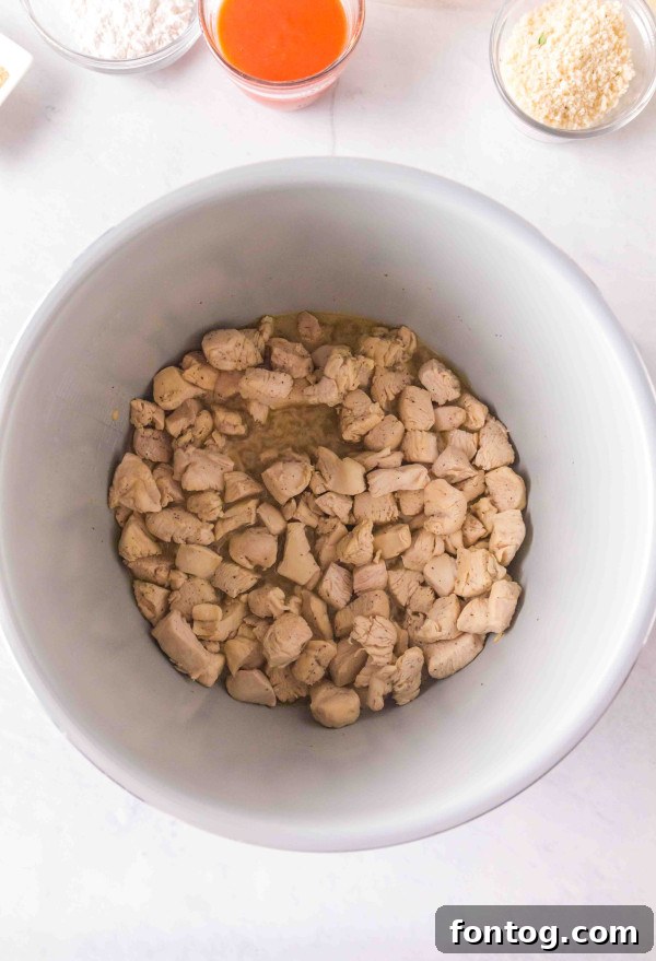 Another view of the ingredients, focusing on cheeses and hot sauce for the Buffalo Mac and Cheese.