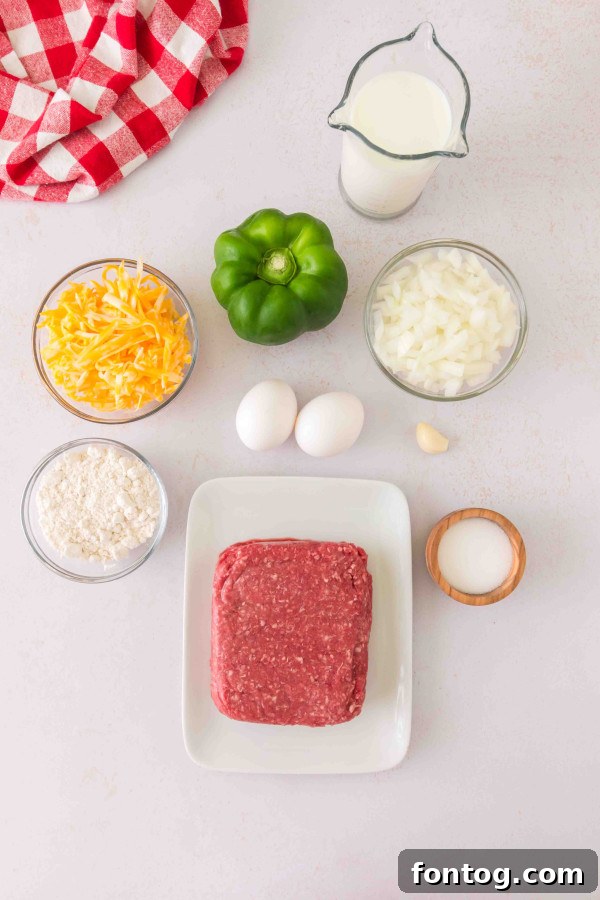 Homestyle Cheeseburger Pie 4 Fresh ingredients laid out for gluten-free cheeseburger pie, including ground meat, vegetables, and cheese