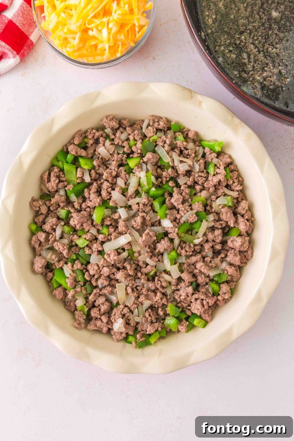 Homestyle Cheeseburger Pie 6 Combining ingredients in a mixing bowl for the gluten-free cheeseburger pie
