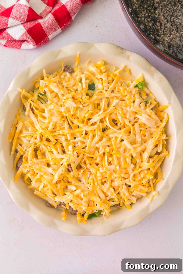 Homestyle Cheeseburger Pie 8 Gluten-free cheeseburger pie assembled in a pie dish, ready to be baked