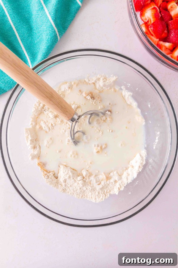 close-up of gluten-free strawberry cobbler ingredients being prepared