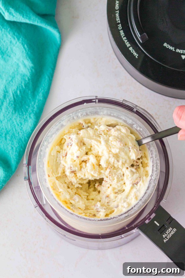 Ninja Creami Butter Pecan Bliss 5 Butter extract bottle next to Ninja Creami pint