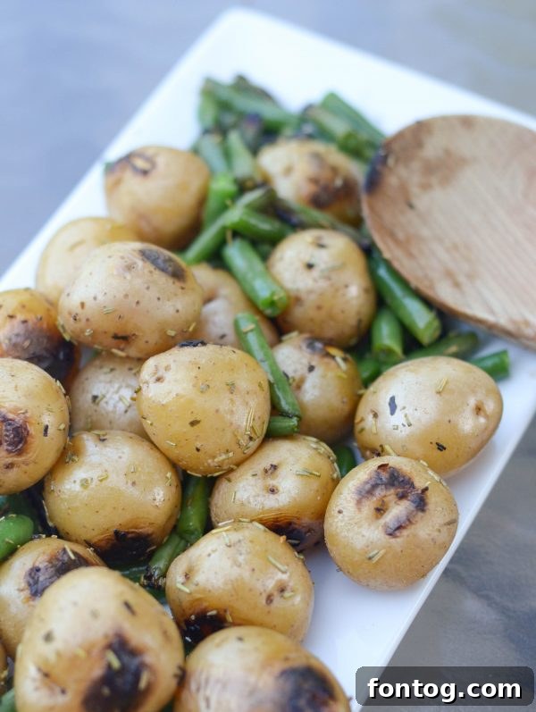 Pellet grill green beans and potatoes in a foil packet on the grill