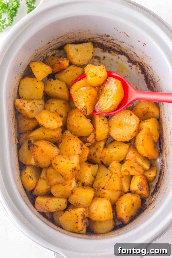 Perfectly golden and crispy slow cooker roasted potatoes