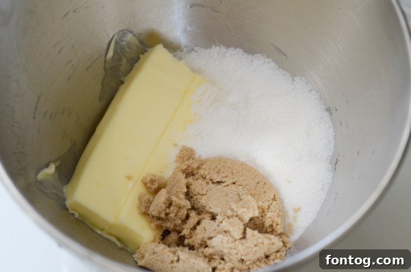 A selection of key ingredients for gluten-free pumpkin spice cookies, including flour, sugar, and spices, laid out on a wooden surface.