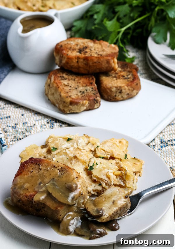 Plated pressure cooker pork chops with gravy, ready to eat