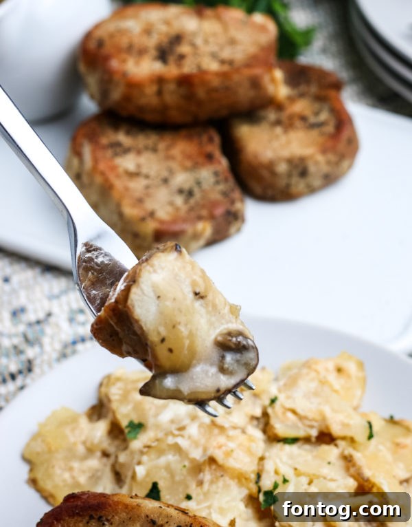 Pressure cooker pork chops with gravy plated with mashed potatoes