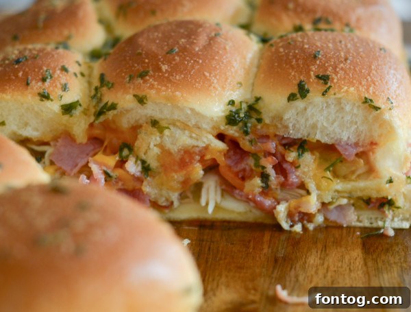 No-Fuss Chicken Bacon Ranch Minis 6 Chicken Bacon Ranch Sliders sliced and ready to be served.