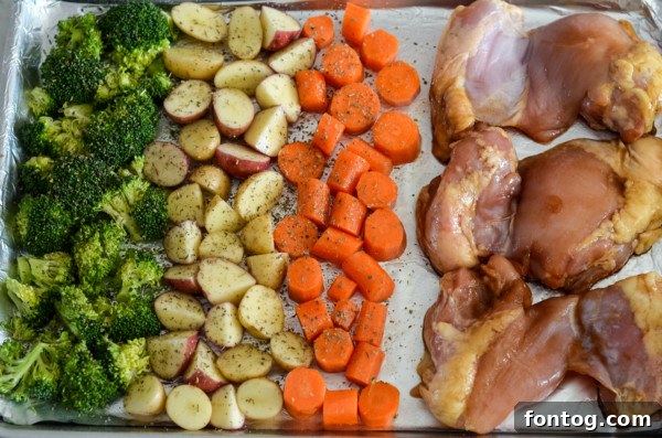 Golden Glazed Chicken Thighs and Roasted Garden Vegetables 3 Arrangement of fresh ingredients for sheet pan chicken: boneless chicken thighs, carrots, broccoli, baby potatoes, and glaze components.