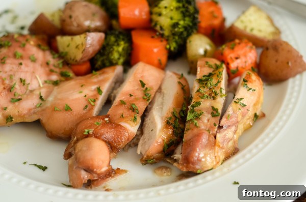 Golden Glazed Chicken Thighs and Roasted Garden Vegetables 6 Close-up of perfectly glazed chicken thighs and roasted vegetables on a sheet pan, showing rich colors and textures.