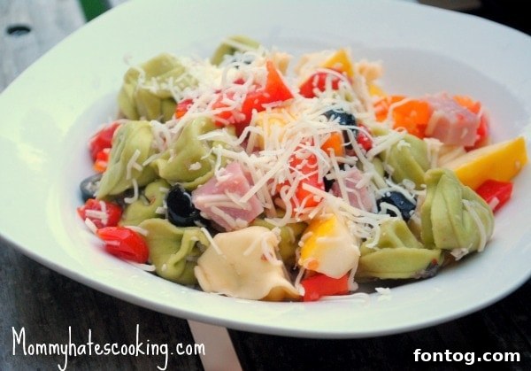 A vibrant Ham and Cheese Tortellini Pasta Salad, featuring savory ham, tender tortellini, fresh vegetables, and a light dressing, perfect for using leftover ham.