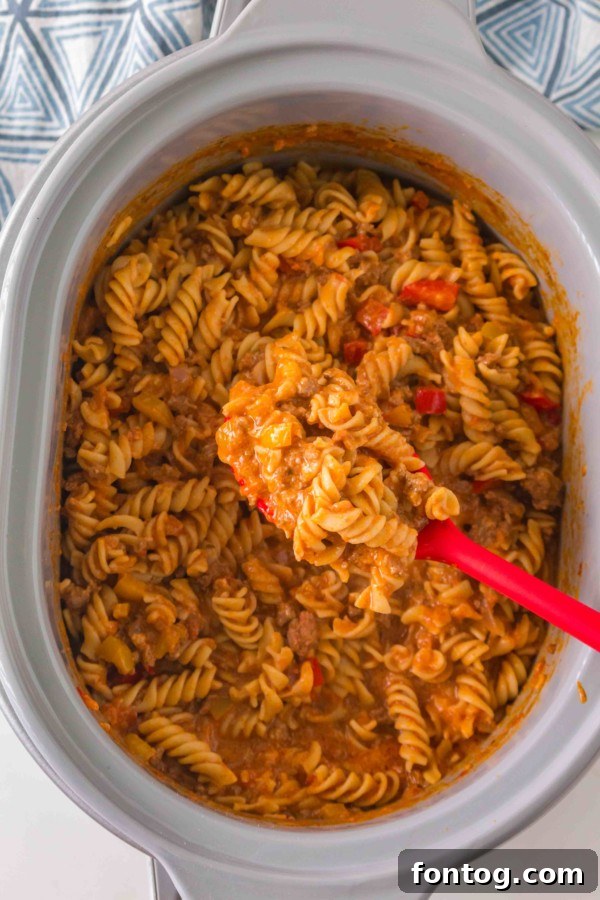 Delicious and cheesy gluten-free slow cooker taco pasta ready to serve