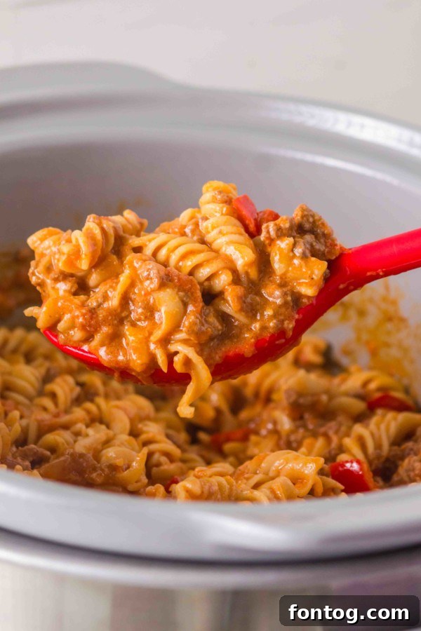 Close-up of a serving of gluten-free slow cooker taco pasta with cheese