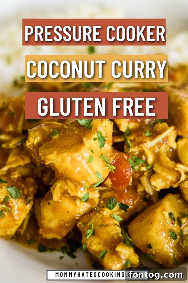 Creamy Pressure Cooker Coconut Chicken Curry 6 Large overhead shot of the pressure cooker coconut chicken curry in a pot with serving utensils