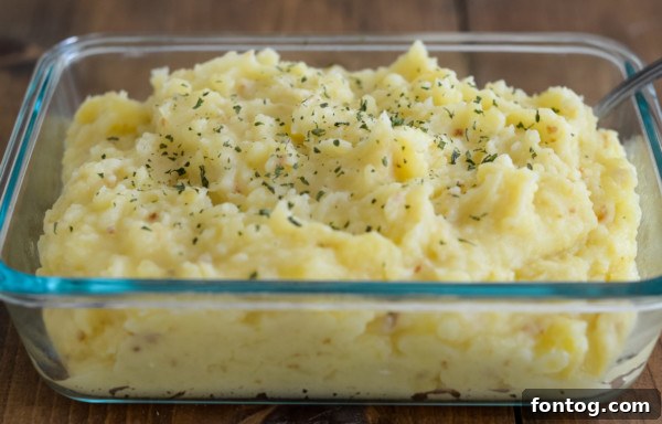 Baked gluten-free make-ahead mashed potatoes, ready to be served.