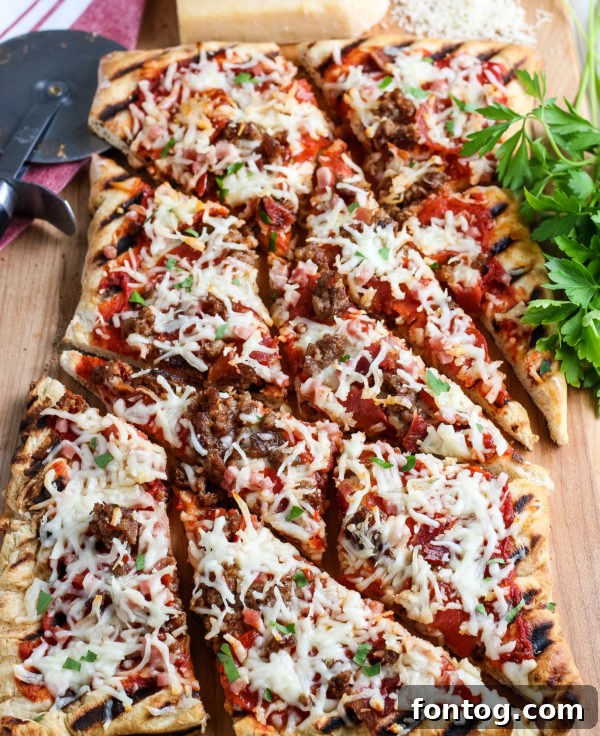 How to Make Grilled Pizza - A delicious pizza fresh off the grill, ready to be sliced.