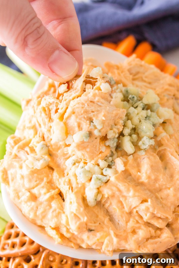 A vibrant display of Pressure Cooker Spicy Chicken Dip with Gorgonzola, beautifully presented for a party setting.