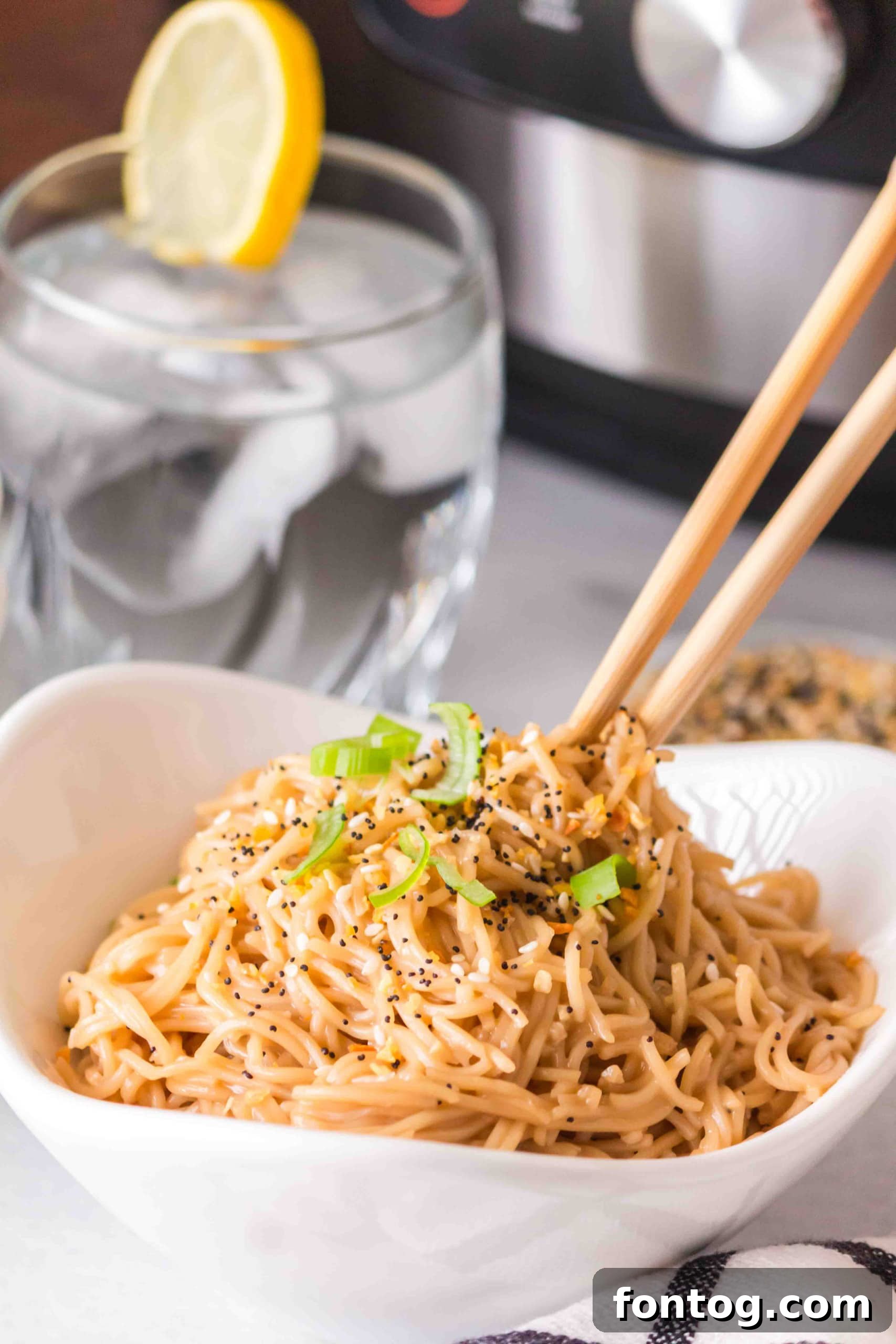 Ramen in a bowl with chopsticks.