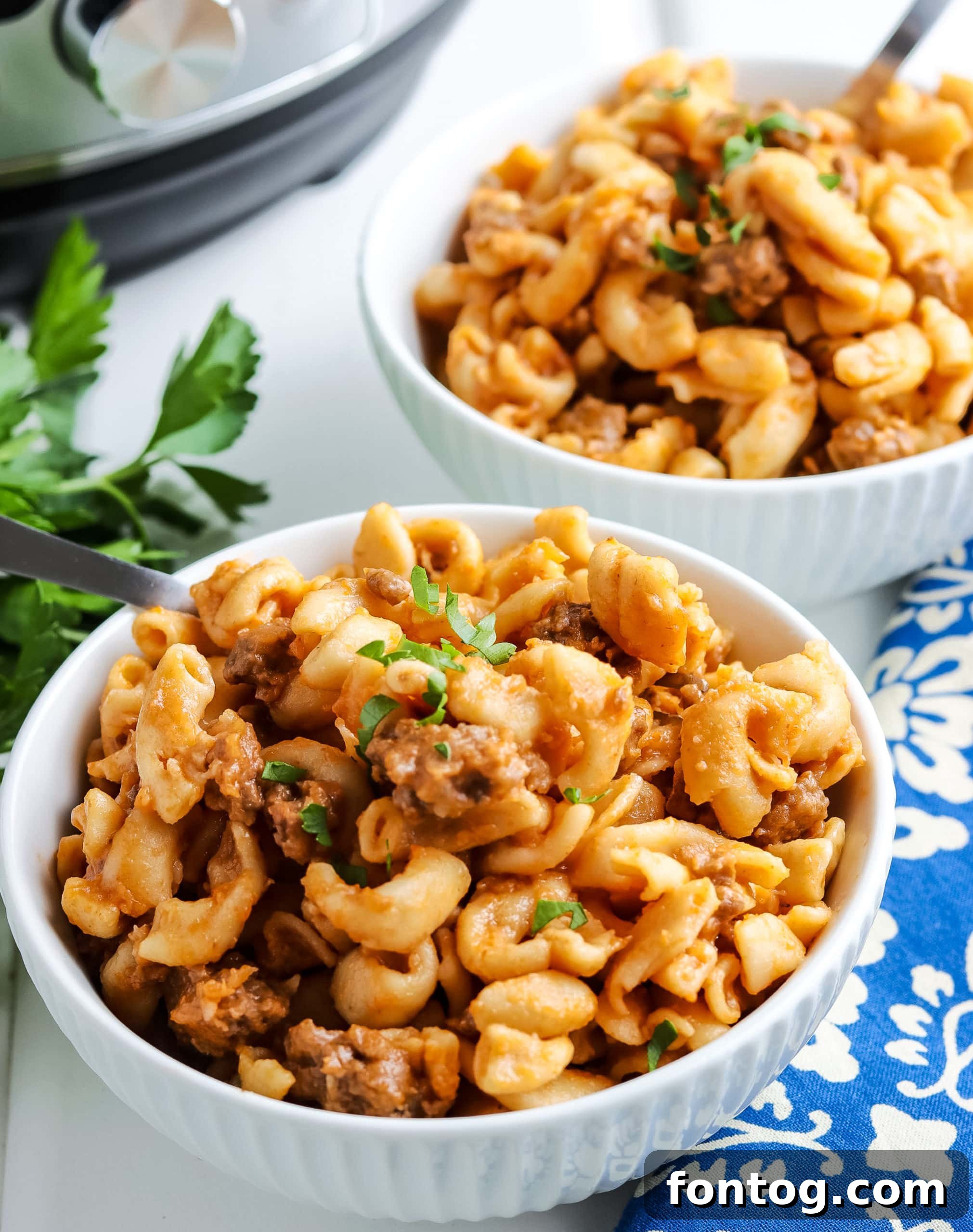 Hamburger helper in a pot with a spoon.