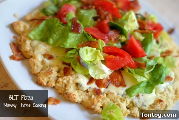 The Ultimate BLT Pizza Delicious BLT Pizza, a perfect twist on a classic, topped with crispy bacon, fresh lettuce, and ripe tomatoes, ready for a cozy fall evening.