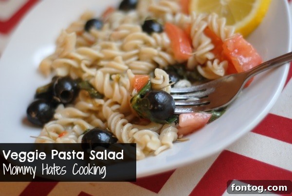 Colorful veggie pasta salad with various chopped vegetables
