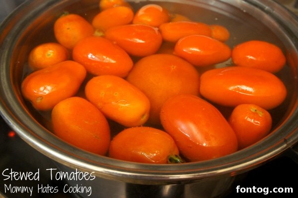 Rustic bowl of homemade stewed tomatoes with fresh herbs