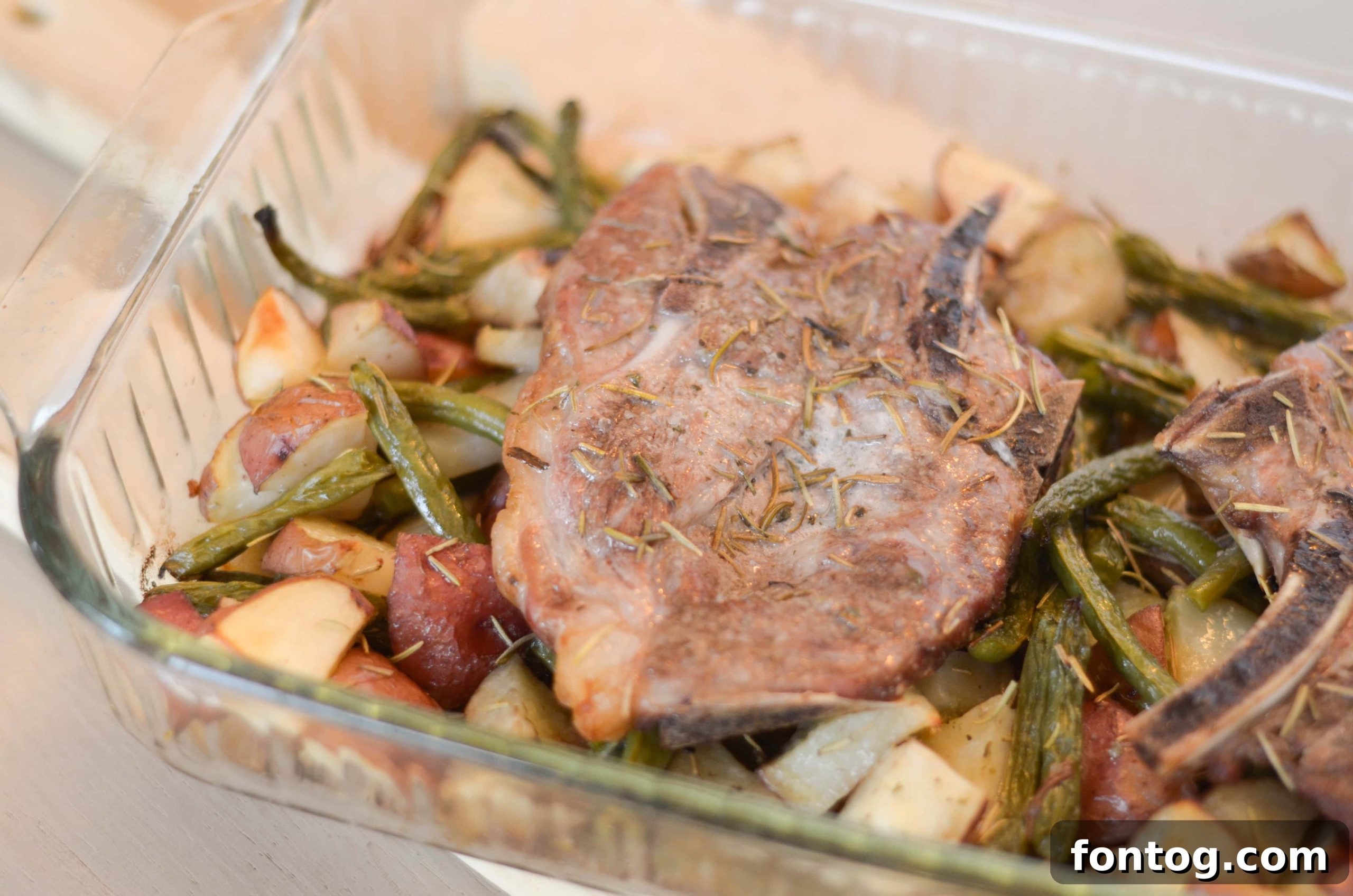 One-Pan Rosemary Pork Chops 7 Recipe card image for One-Dish Rosemary Pork Chops