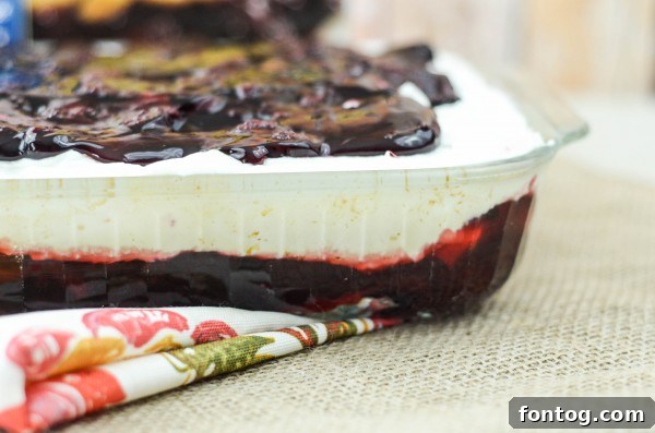Adding whipped topping to the ice cream cake
