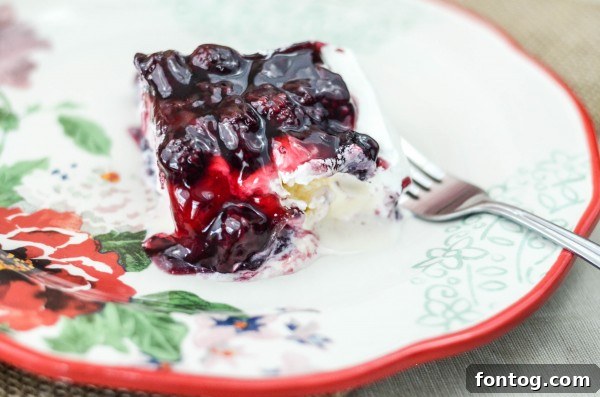 Blackberry Cobbler Ice Cream Cake with fresh blackberries on top