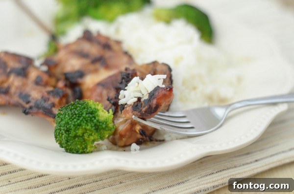 Sticky Gluten-Free Teriyaki Chicken Skewers 5 Raw chicken thighs cut into cubes on skewers, ready for grilling