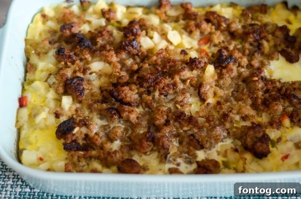 Ultimate Sausage Breakfast Bake 4 A baking dish filled with potatoes, sausage, and eggs