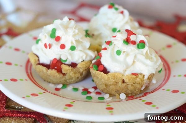 Rolled out sugar cookie dough being cut into circles with a round lid for cookie cups