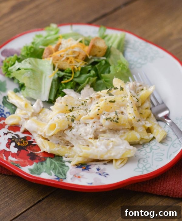 Velvety Slow Cooker Chicken Alfredo 2 Delicious Slow Cooker Chicken Alfredo with creamy sauce and fresh parsley