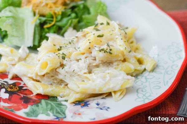 Velvety Slow Cooker Chicken Alfredo 5 Complete meal of Slow Cooker Chicken Alfredo with salad and garlic bread