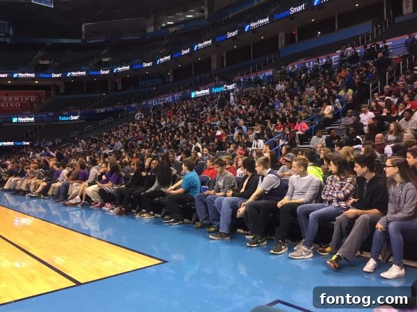 Hill Harper engaging enthusiastically with a diverse group of middle school students during a #FutureSmart event.