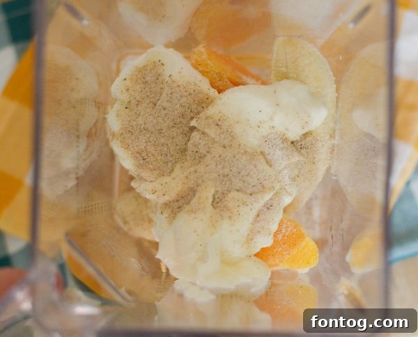 A glass of Banana Orange Smoothie, indicating the ease of incorporating Metamucil Free for daily fiber intake. #FiberRich #MetamucilWellness