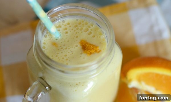 Ingredients for a Banana Orange Smoothie laid out, emphasizing simplicity and natural goodness. Includes banana, orange, Greek yogurt, and Metamucil Free. #SimpleIngredients #HealthyEating