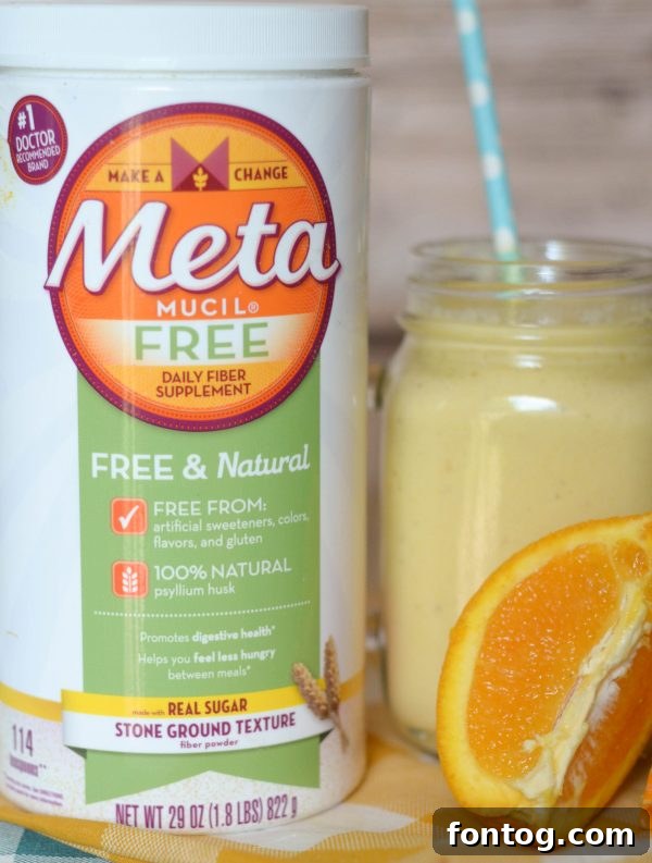 Preparing a Banana Orange Smoothie, showing the blending process for a smooth, creamy texture. An easy recipe for a nutritious start to the day. #BlendItUp #EasyRecipes