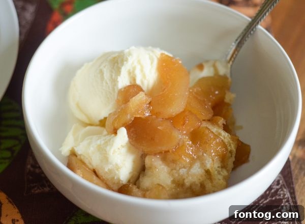 Close-up of baked Caramel Apple Magic Cobbler with golden topping