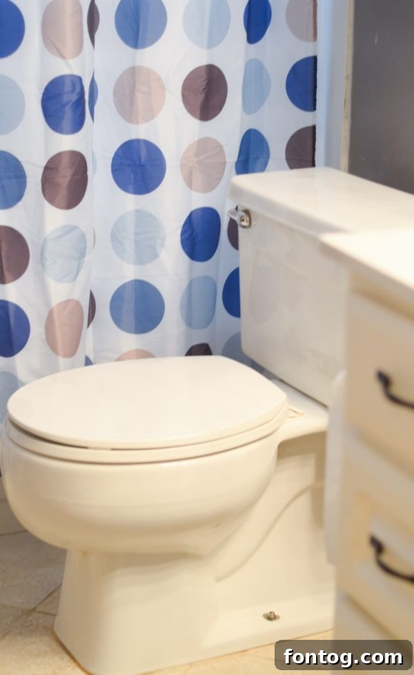 Bright bathroom interior with cleaning supplies, highlighting a fresh and organized space.