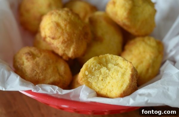 A plate of air fryer hush puppies with various dipping sauces