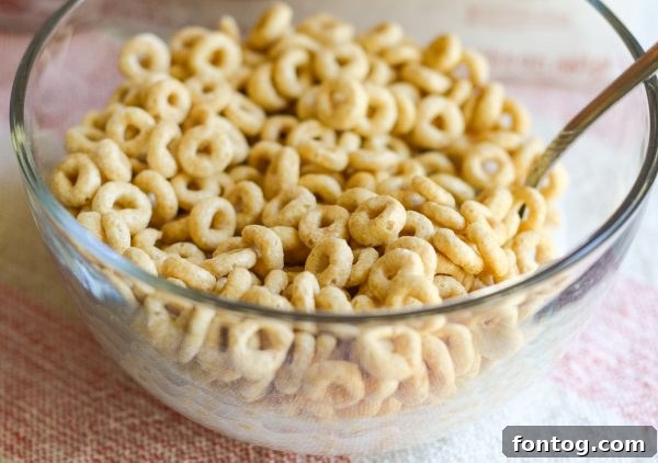 Two kids eating cereal